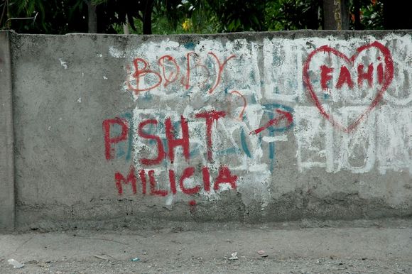 Graffiti on a wall in Dili that links the martial arts group ‘PSHT’ with the militia Trapped in the legacy of the past